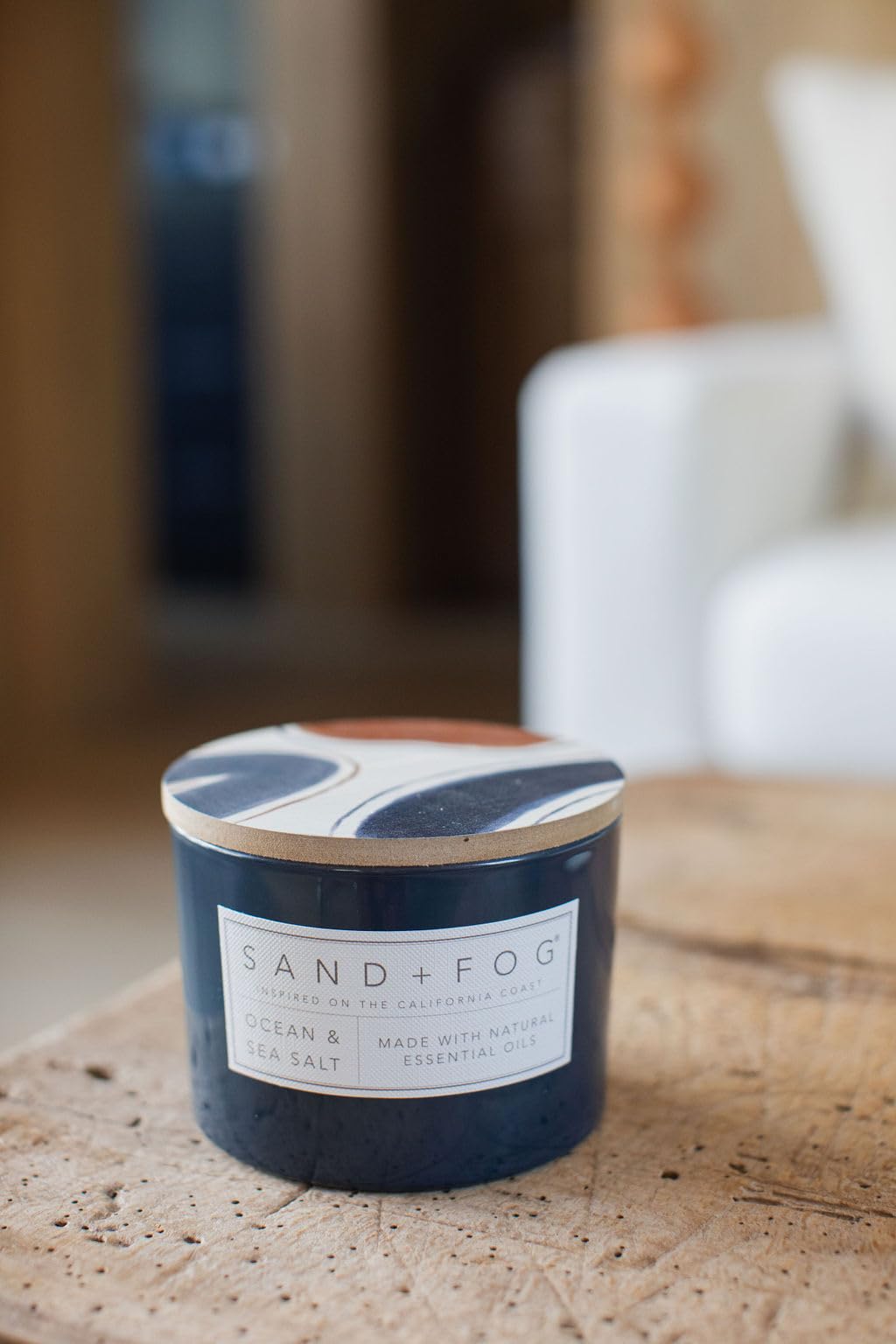 Sand + Fog Ocean & Sea Salt candle in living room creates inviting glow.