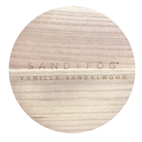 Sand + Fog Vanilla Sandalwood candle lid art adds elegant decor.