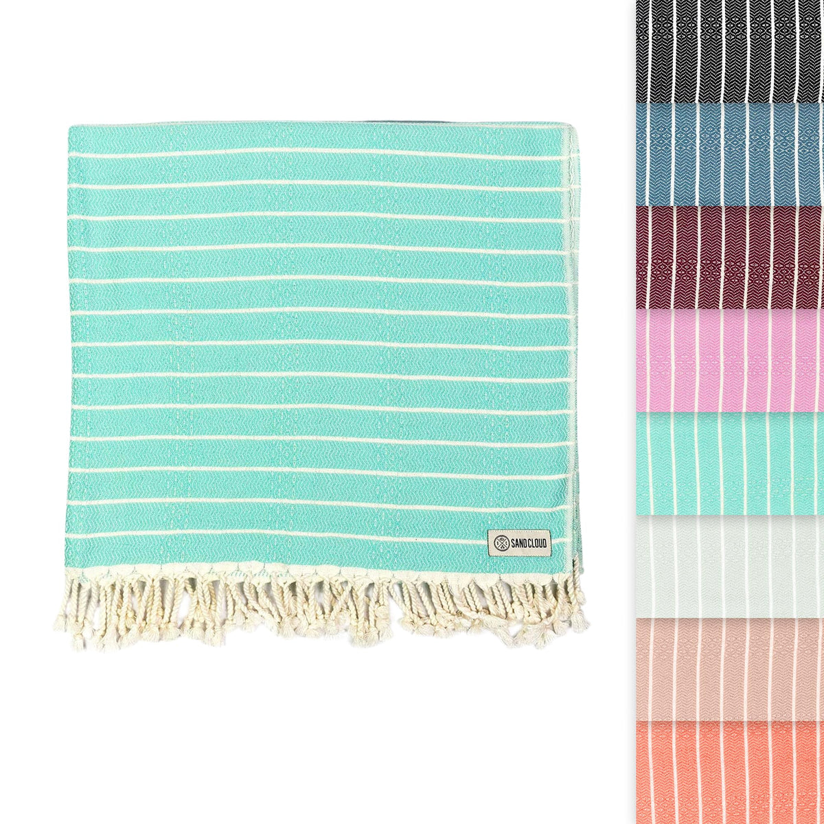 Sand Cloud Gocek Mint sand-free Turkish towel on the beach.