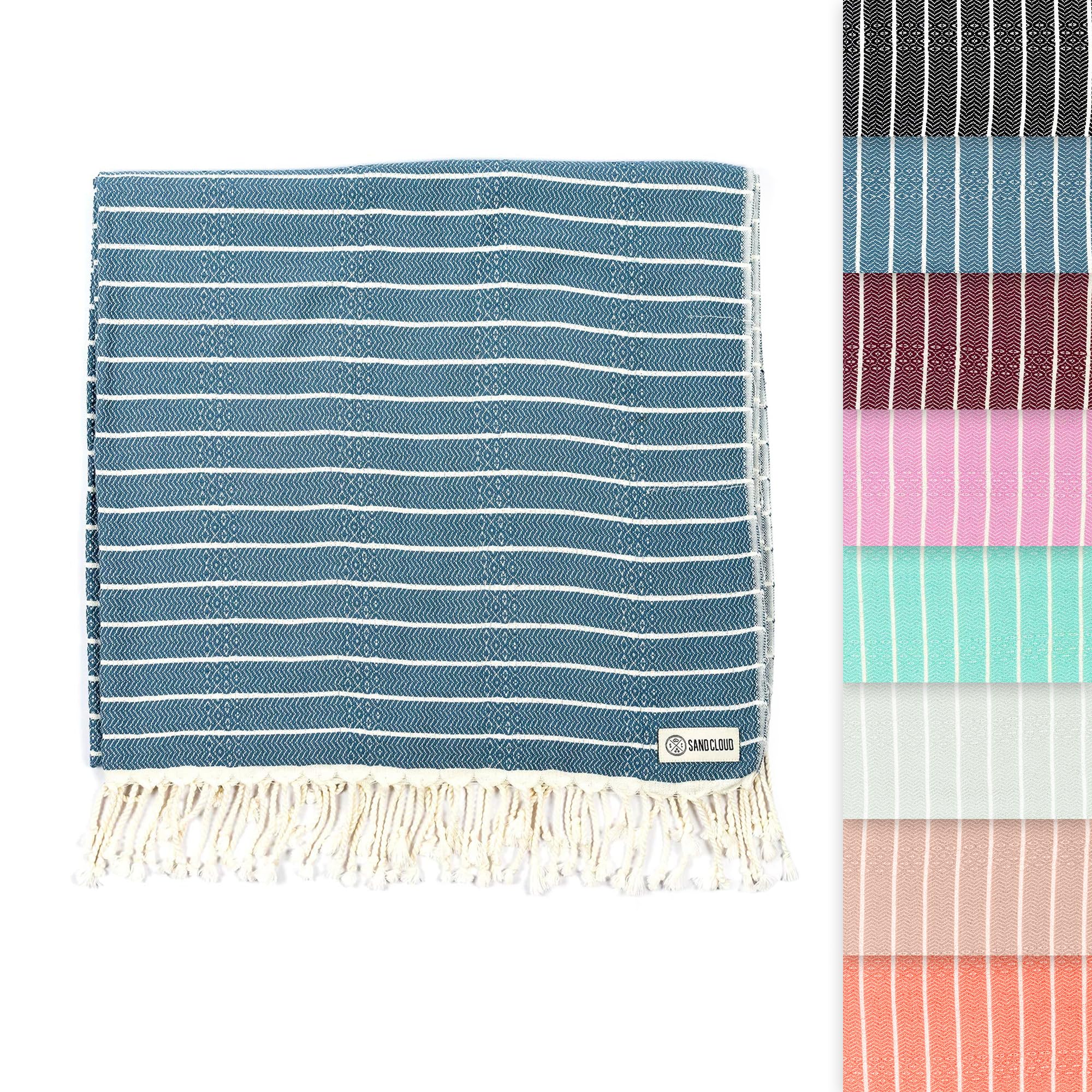 Sand Cloud Turkish Beach Towel Gocek Denim on sand, a portable, sand-resistant beach scene.