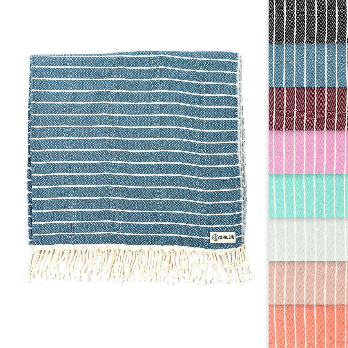 Sand Cloud Turkish Beach Towel Gocek Denim on sand, a portable, sand-resistant beach scene.