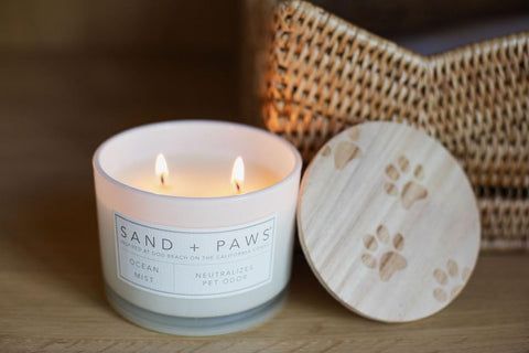 Sand + Paws Ocean Mist candle fills room with inviting scents while you relax.