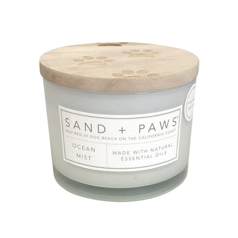 Sand + Paws Ocean Mist jar candle with soft glow that helps neutralize pet odors.