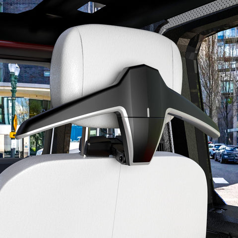 Sandure headrest rod installation step demonstrates easy setup without removing the headrest.