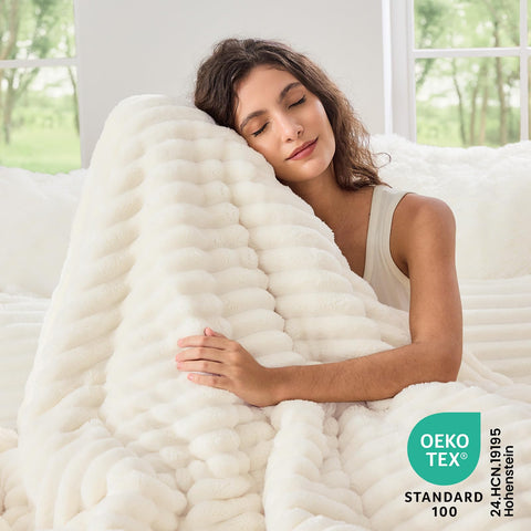 Sasttie King Comforter Set on bed demonstrates cozy warmth for chilly nights.