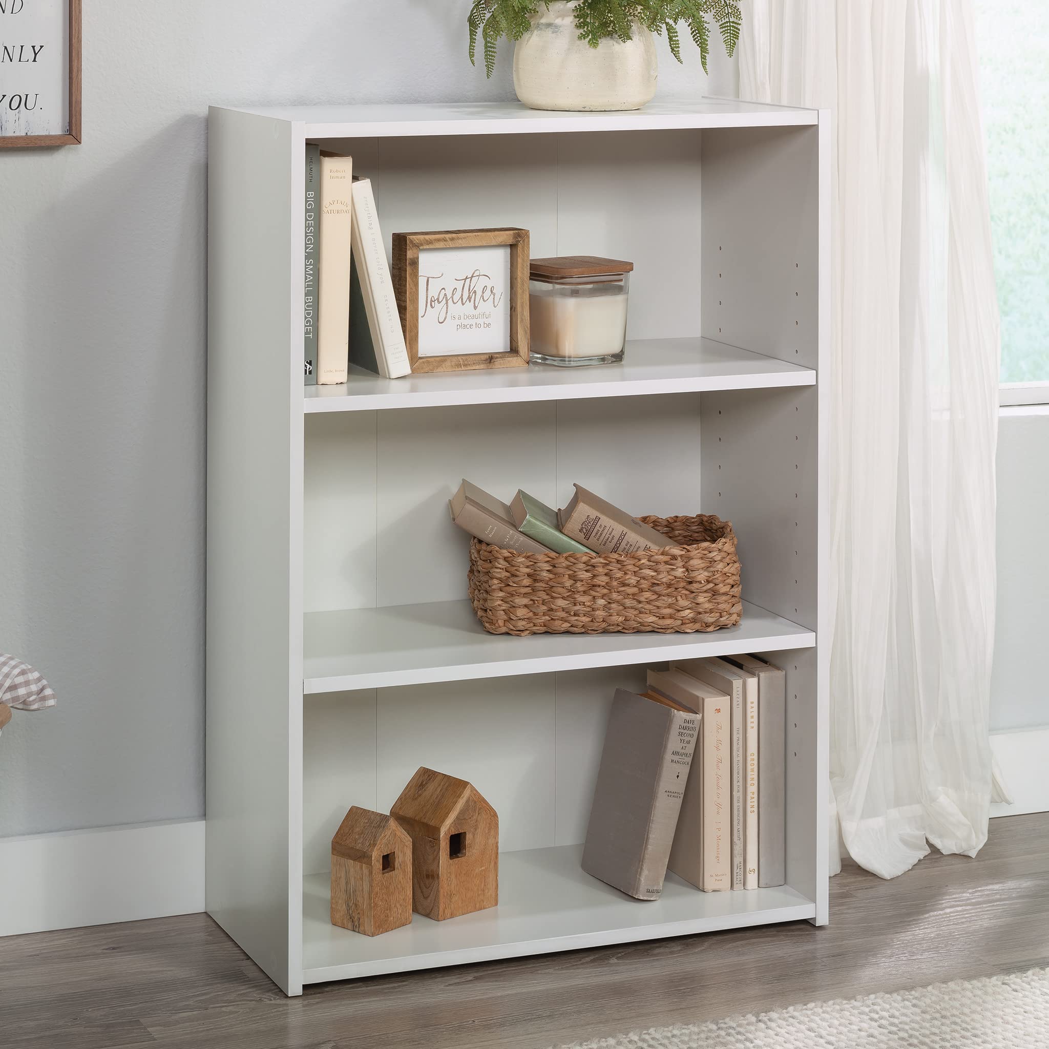 Sauder Beginnings 3-shelf bookcase in soft white, side view for hallway display