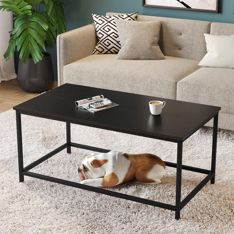 SAYGOER Black Coffee Table underneath storage area keeps cushions within reach.