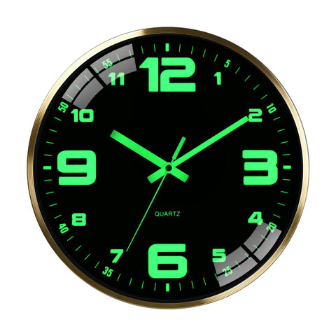 Scnfed 12-inch luminous clock with metal frame glows softly in low light.