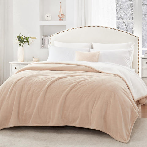 Sealy king-size beige blanket close-up highlighting fabric texture.