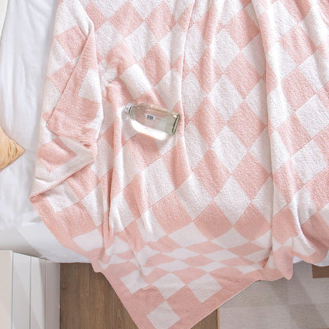 SeaRoomy checkered throw blanket on bed for cozy bedroom decor.