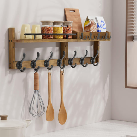 Segtenant rustic pine base with dark iron hooks for vintage charm.