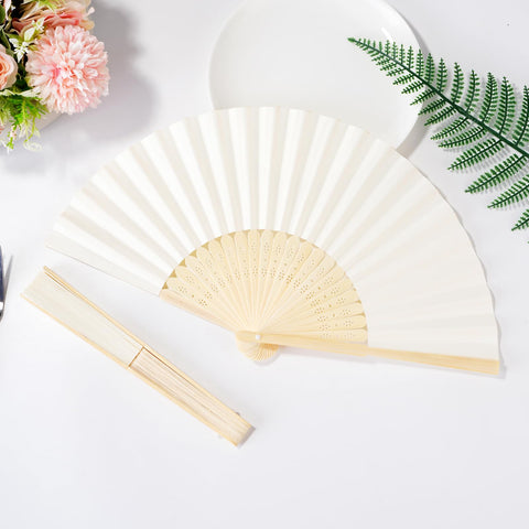 Sepwedd cream hand fan decor at a wedding setup.