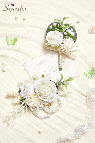 Serwalin white floral arrangement with greenery accents adds texture.