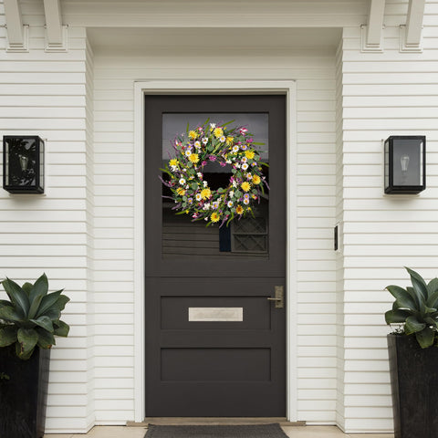 Sggvecsy wreath over fireplace mantel adds cozy seasonal charm.