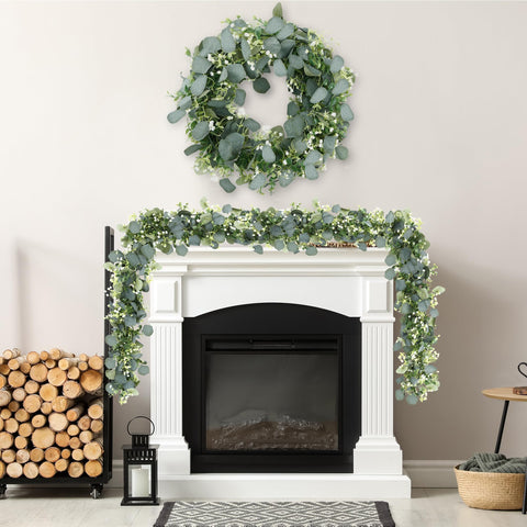 Sggvecsy white flowers and greenery accent the garland