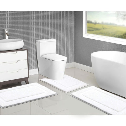 SHACOS rugs placed by sink and tub create a clean, inviting entry.