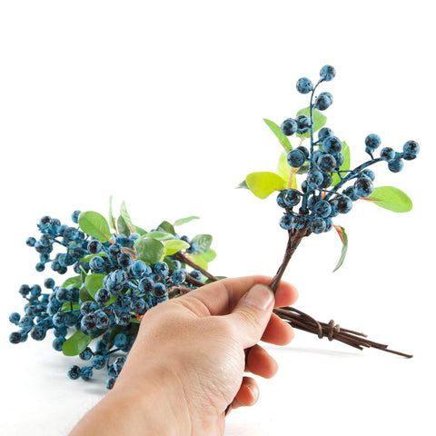 SHACOS blue berry stems brighten table centerpieces with vibrant, lifelike color.