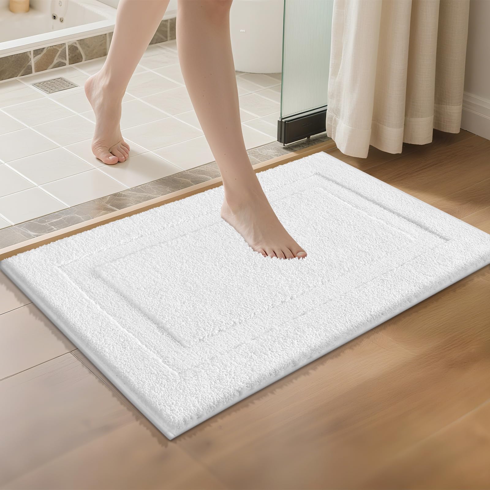 SHACOS white rug placed near sink, keeps feet dry and floors clean.