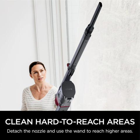 Shark Vertex Pro Multiflex wand reaching under furniture and corners.
