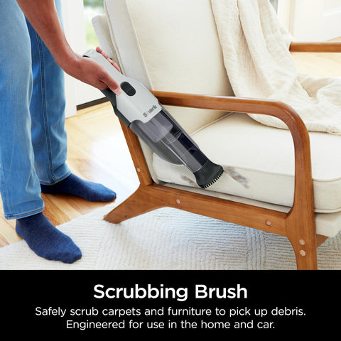 Shark Cyclone PET vacuum scrubbing-brush removing stubborn dirt from carpet.