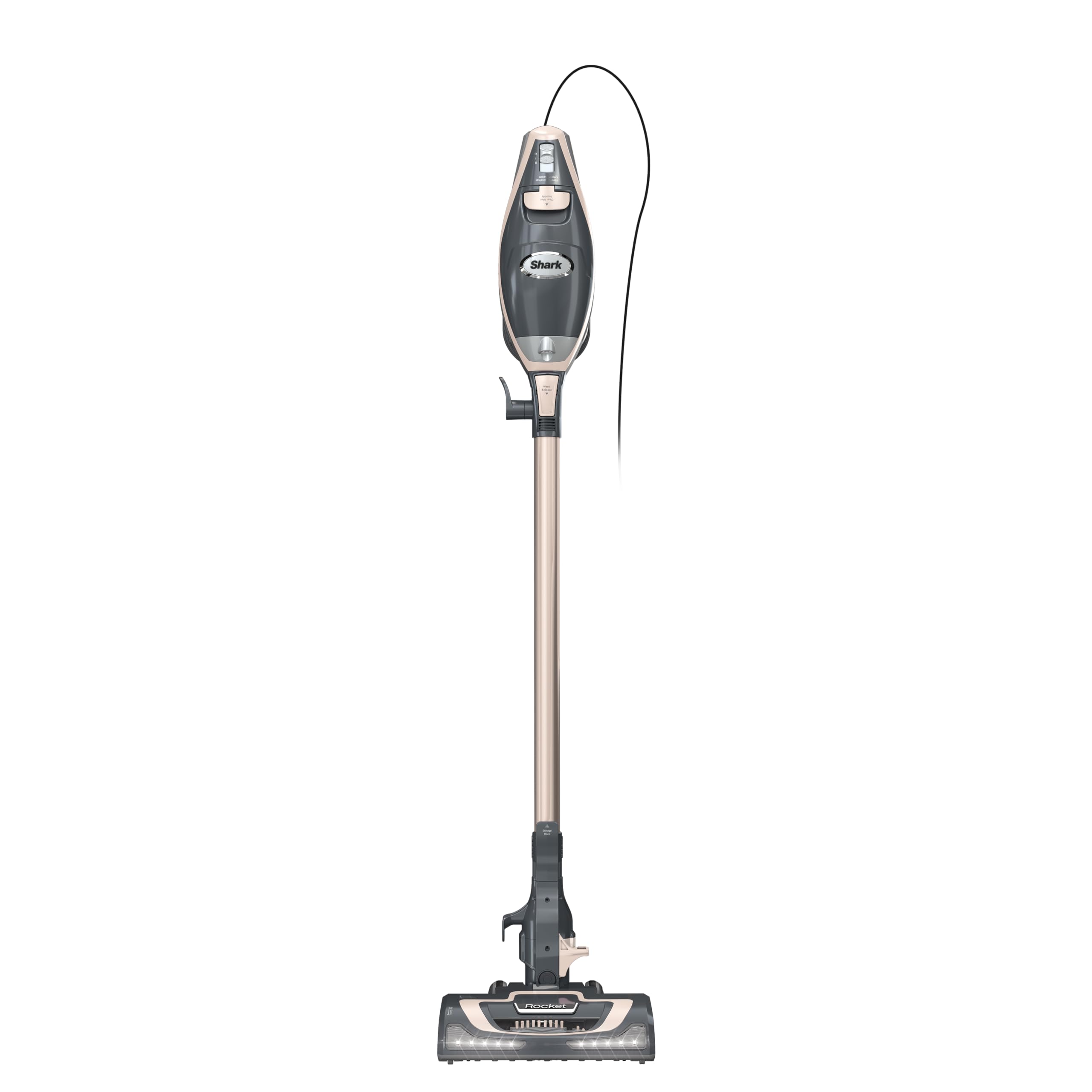 Shark Rocket Pro DLX corded stick vacuum with LED headlights illuminating debris on hardwood