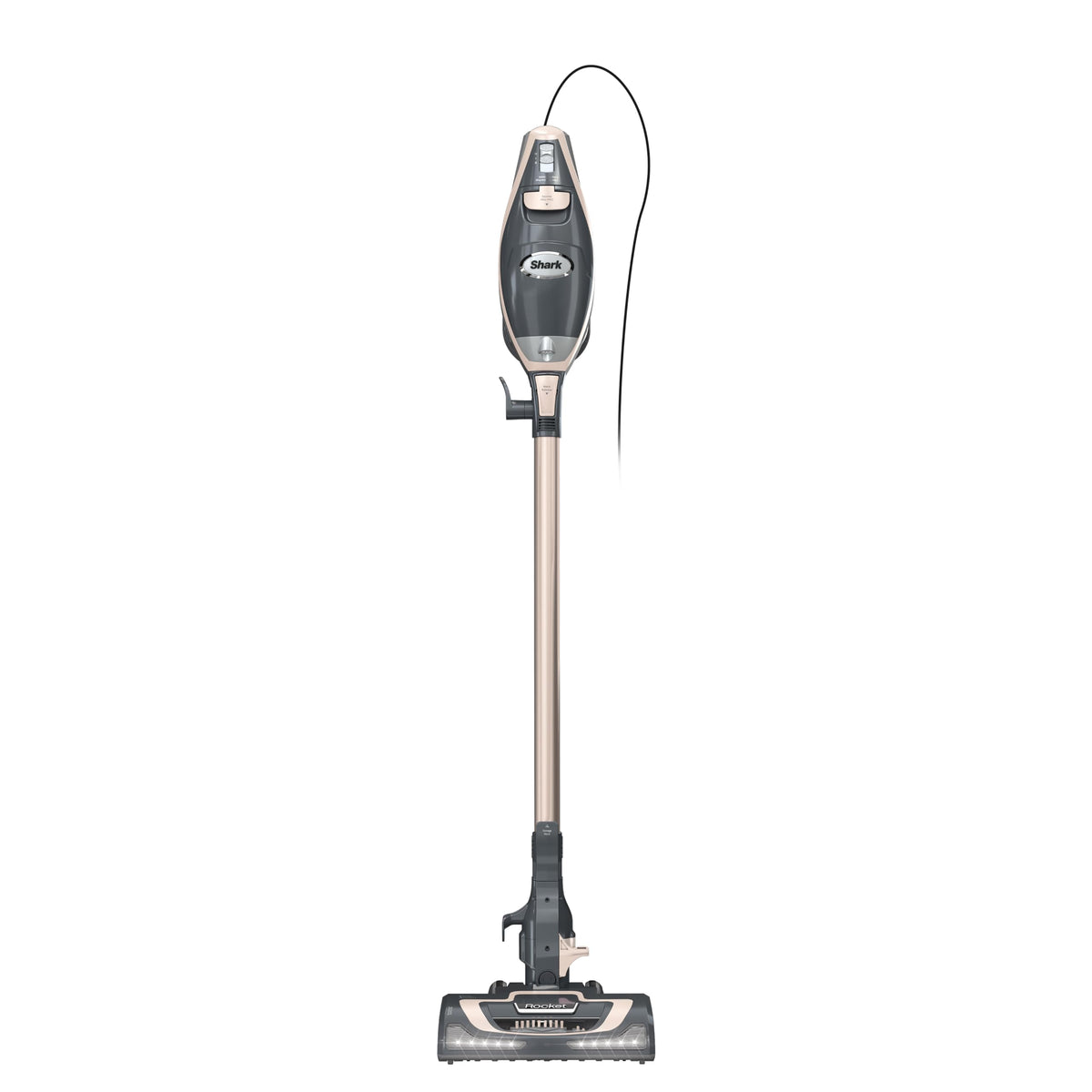 Shark Rocket Pro DLX corded stick vacuum with LED headlights illuminating debris on hardwood