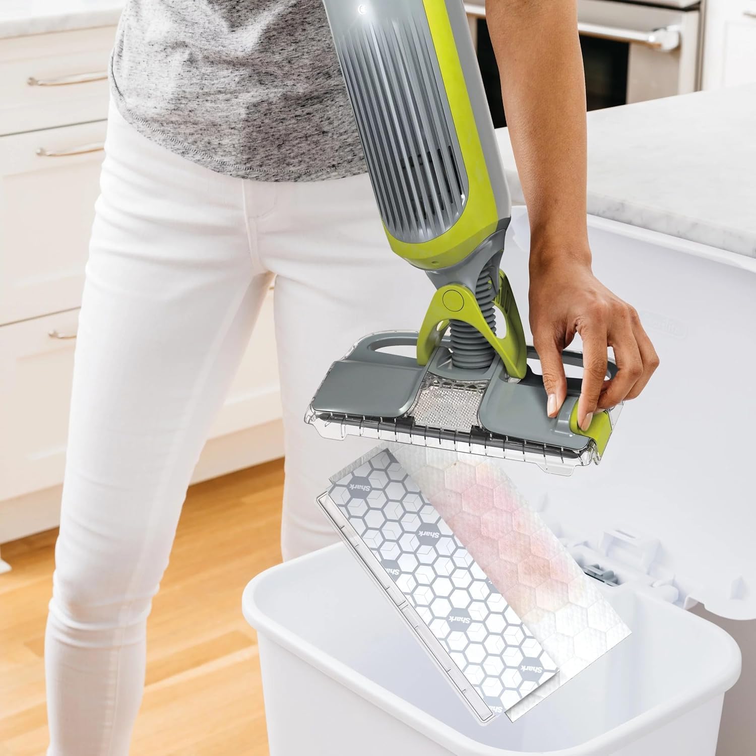 Shark VACMOP shows no-touch disposal feature for easy pad removal.