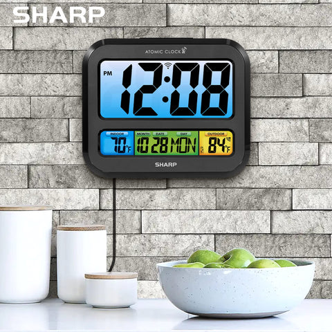 Sharp Atomic Clock shows indoor and outdoor temperature for quick context.
