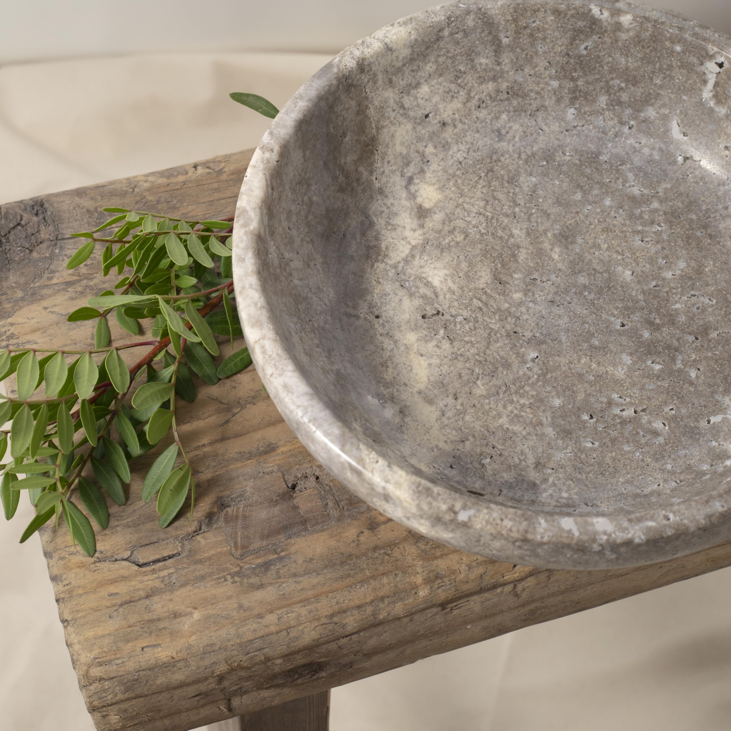 Shelf & Nook travertine bowl bathroom potpourri display adds rustic charm.