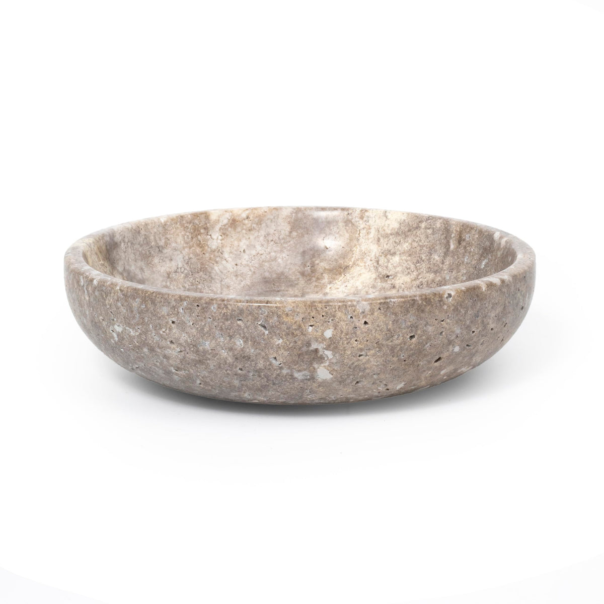 Shelf & Nook travertine white bowl on entryway table adds natural elegance and practicality.