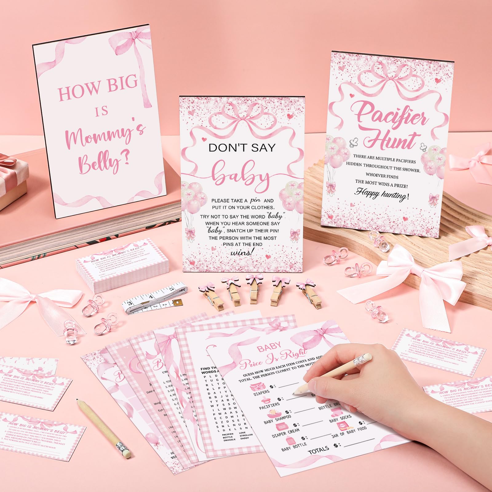 Sherr measuring belly sign with cards to spark guessing fun