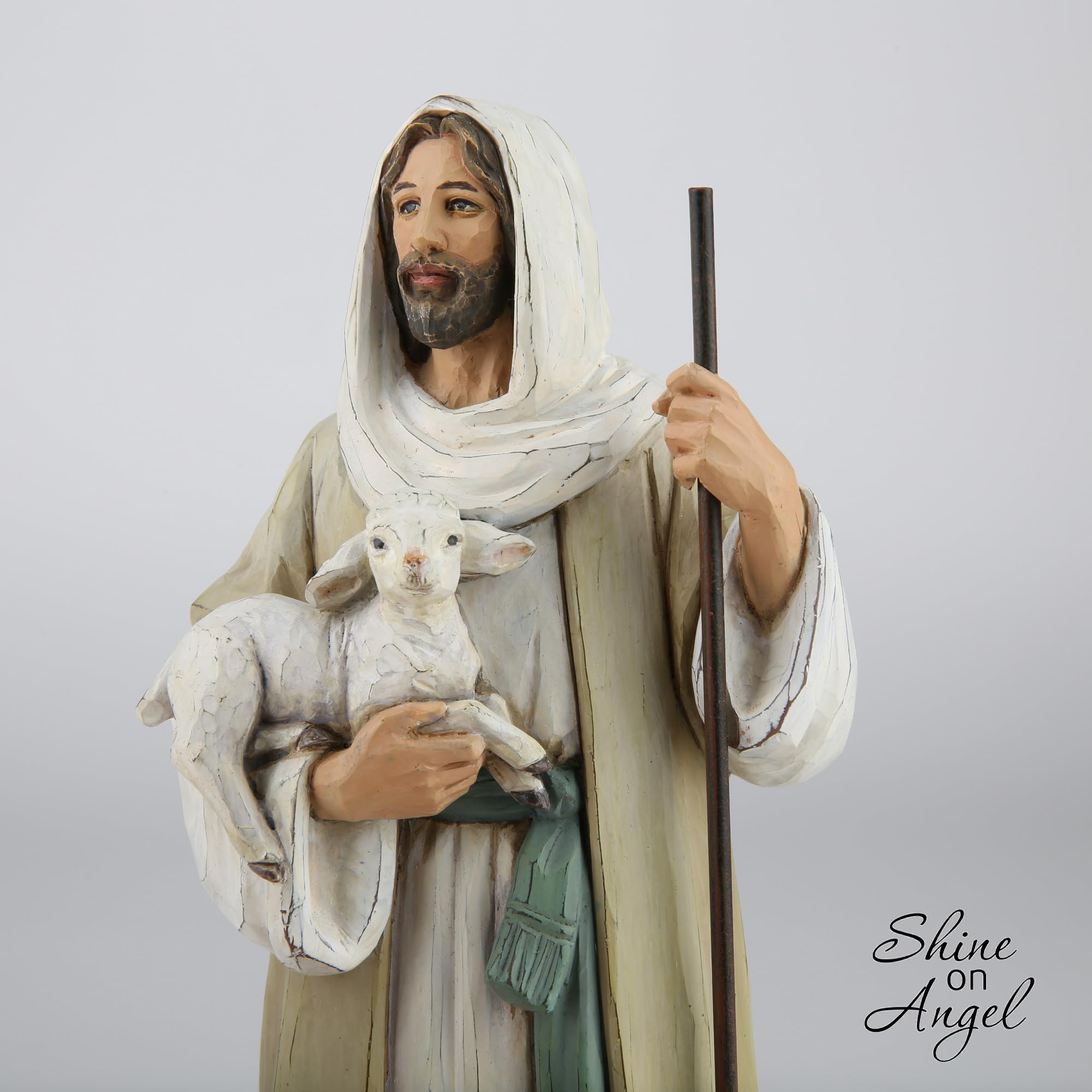 ShineOnAngel Jesus holding lamb figurine closeup showing tender craftsmanship for shelves.