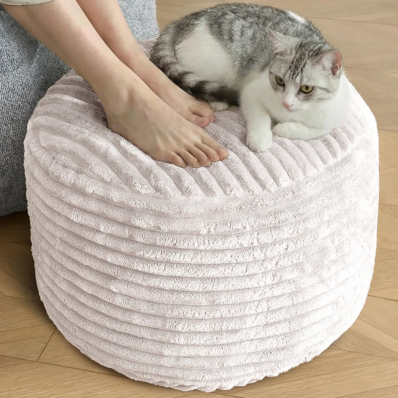 SHOUREN stuffed round pouf ottoman in beige provides soft seating and compact storage.