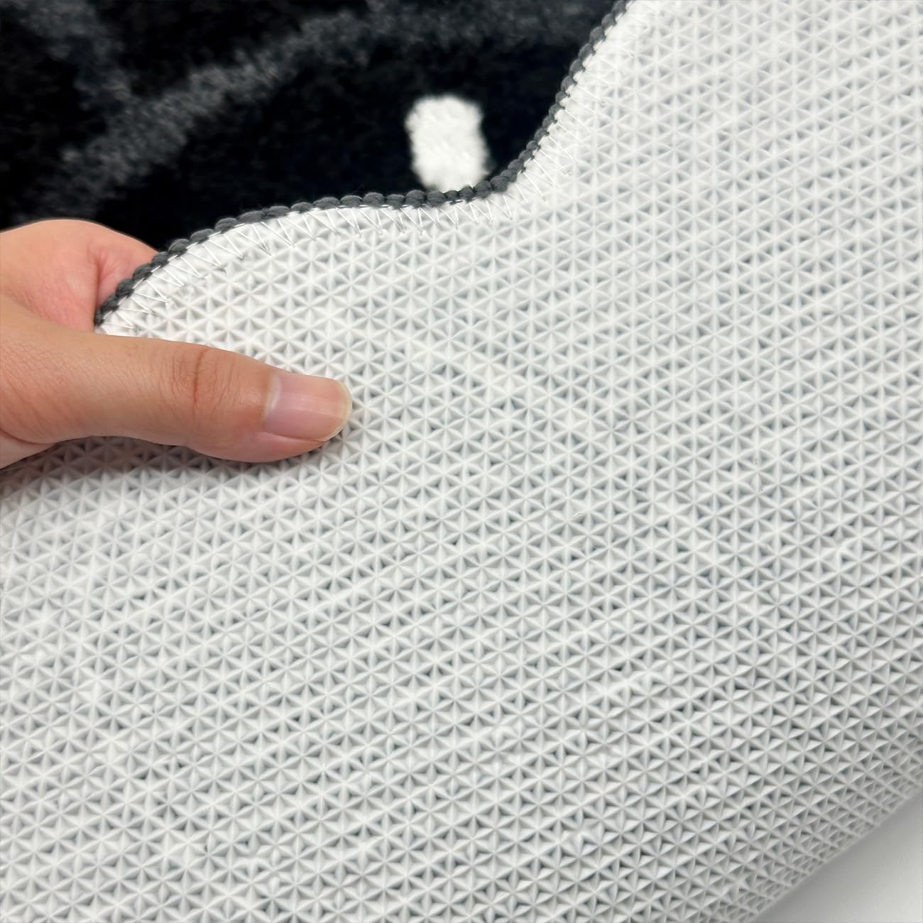 Non-slip backing from TPR helps stay in place on smooth bathroom floors.