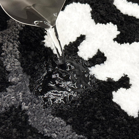 Close-up view shows soft plush pile and durable stitching on the Shovagy rug.