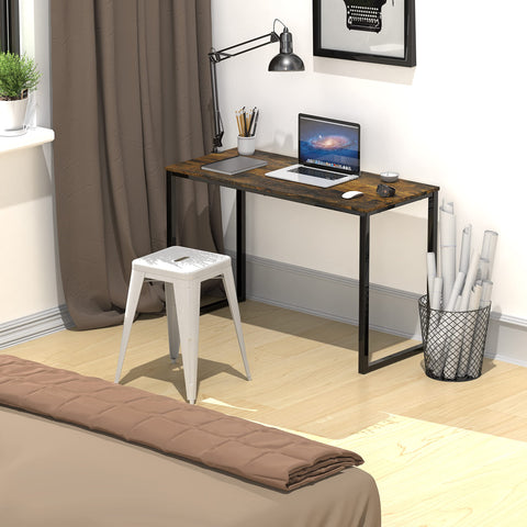 Dorm room setup with SHW Mission desk and laptop