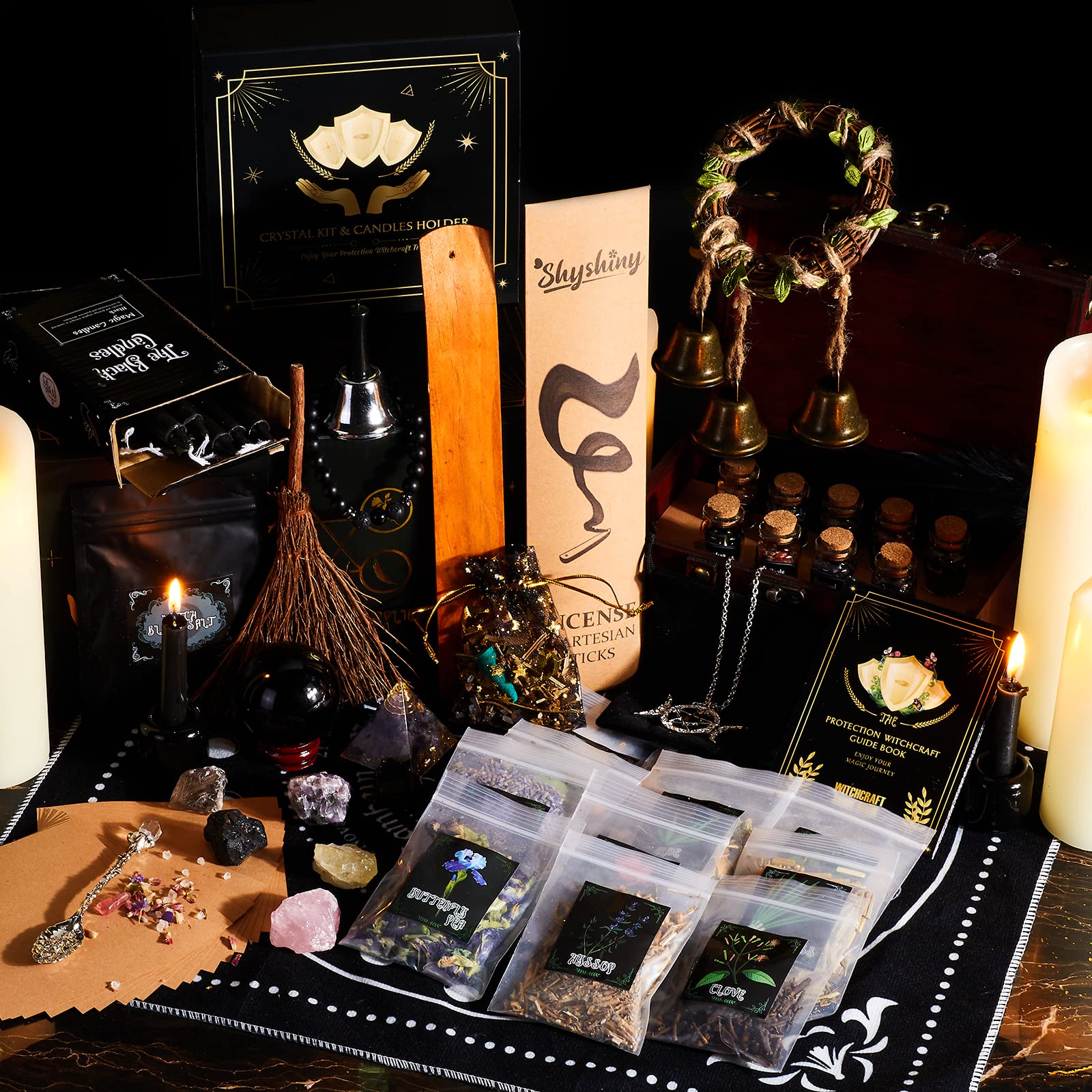 SHYSHINY ritual tools like broom, feathers, bells for altar cleansing.
