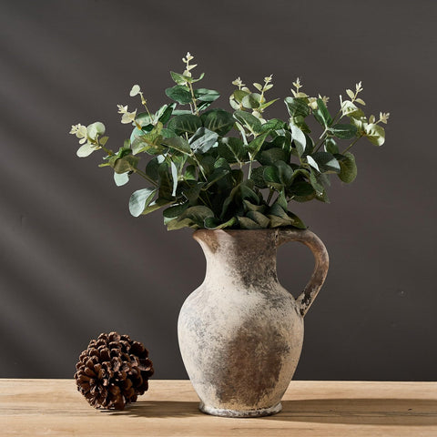 SIDUCAL handmade terracotta vase adds unique texture to shelves and tabletops.