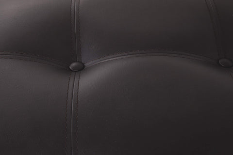 Signature Design by Ashley Haddigan faux leather upholstery combines durability with easy care.