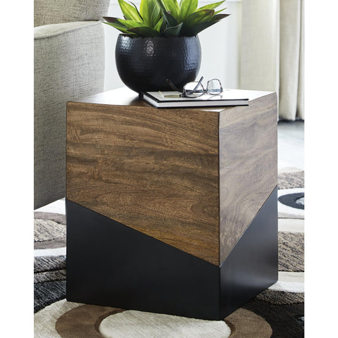 Trailbend end table shown beside a sofa for versatile bedside or living room use.