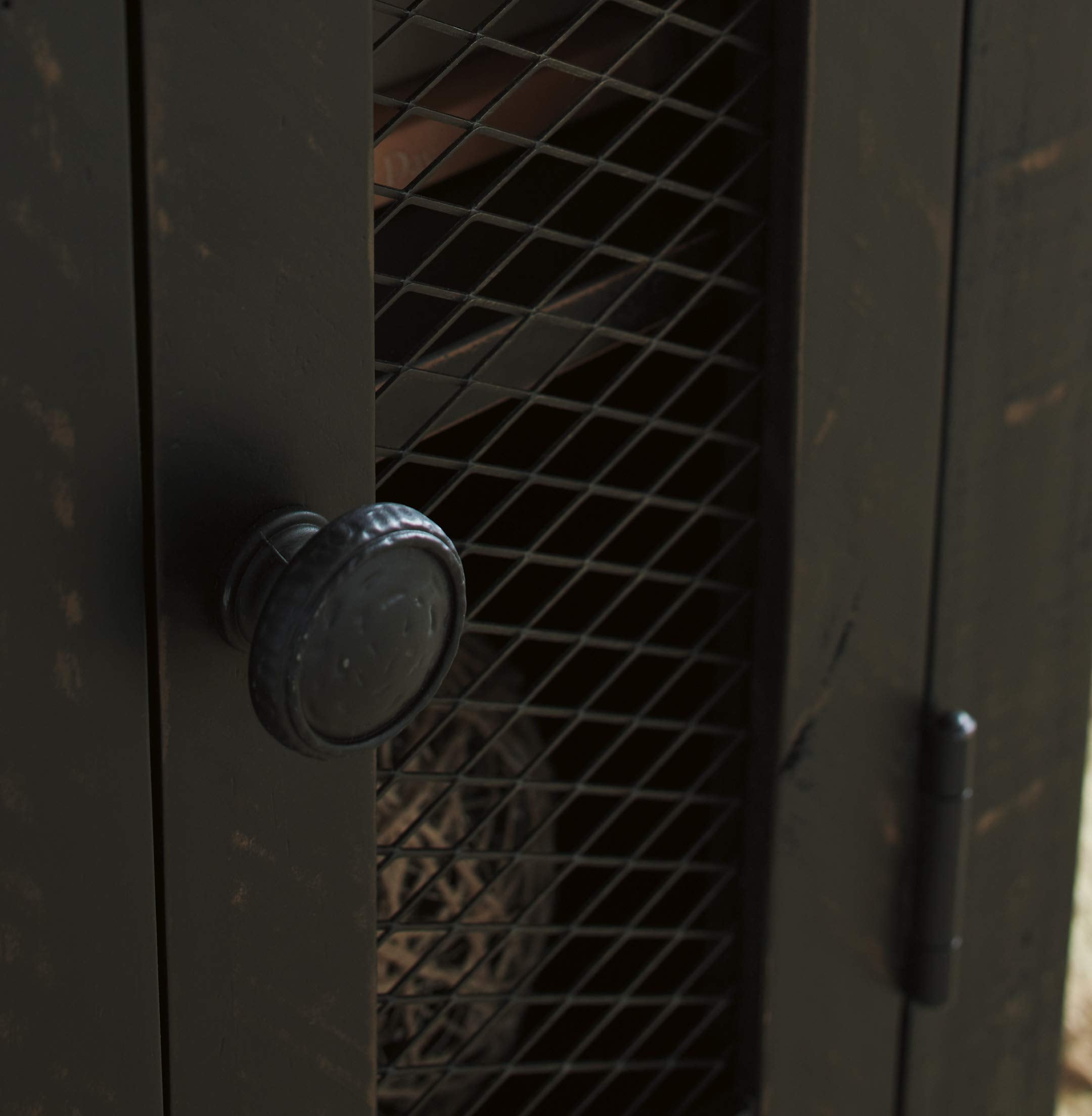 Wire mesh door with vintage hardware accents on Valebeck end table.
