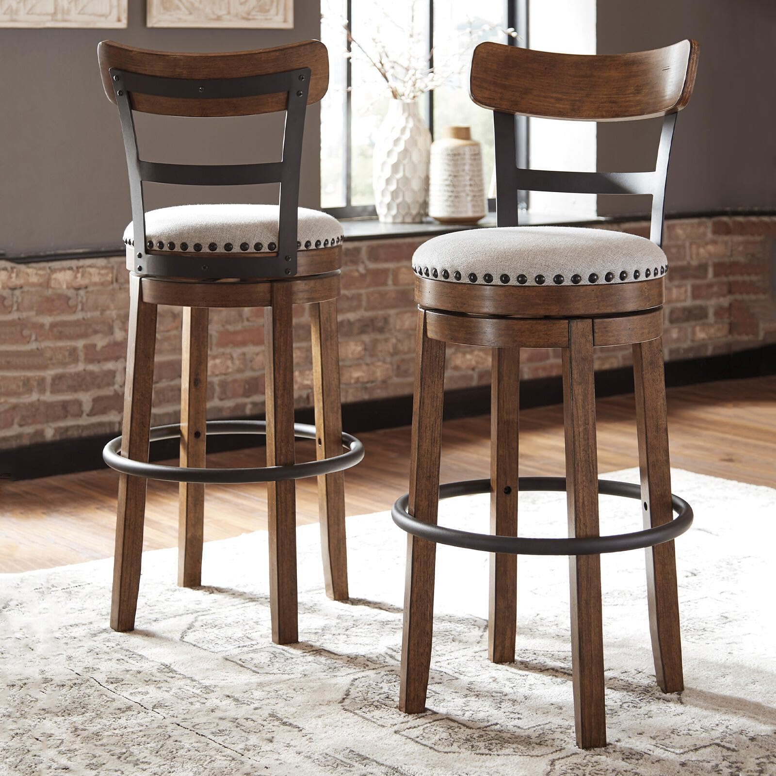 Signature Design by Ashley Valebeck swivel barstool enables easy conversation at the island