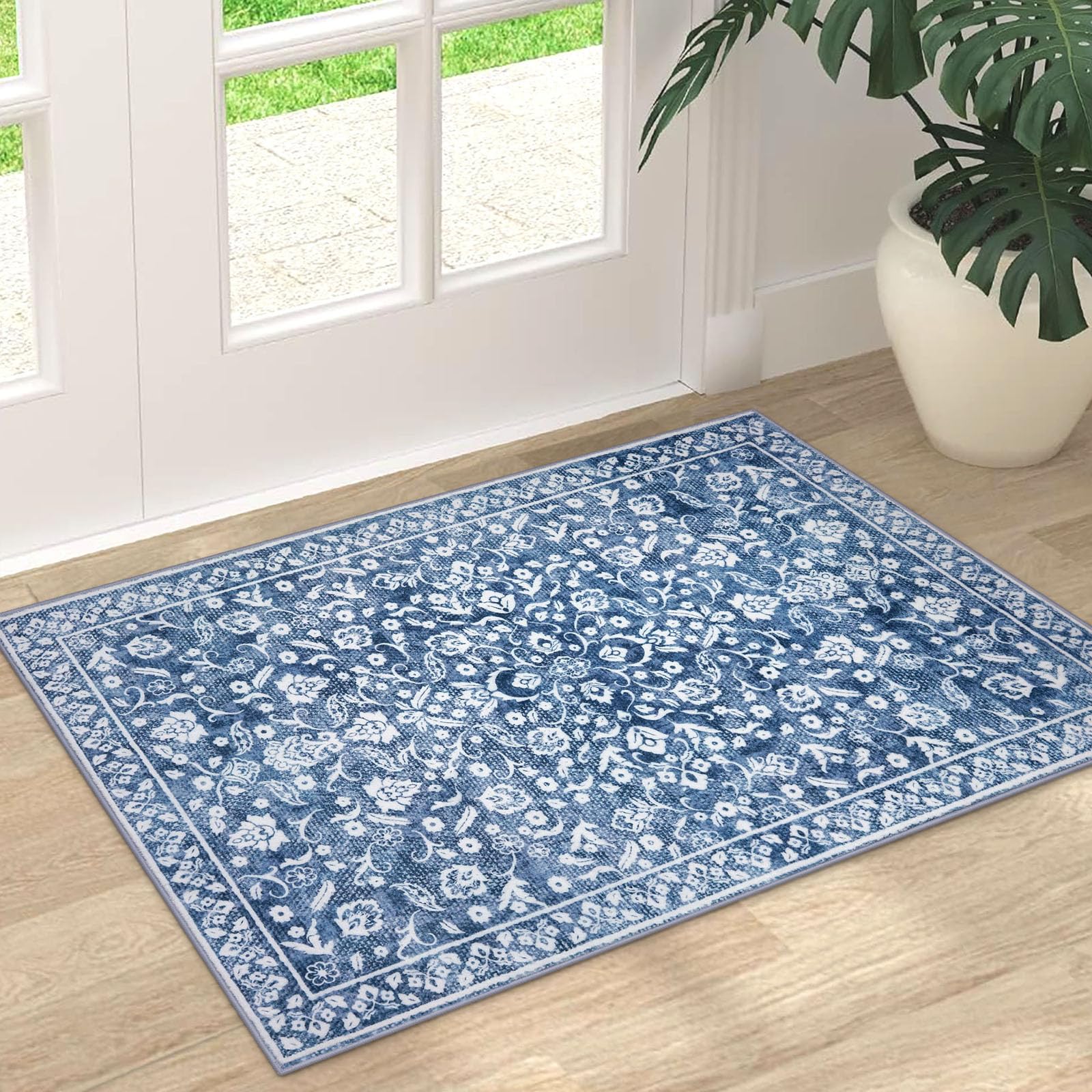 SILOLOOM bedside rug; blue floral design adds warmth beside the bed.
