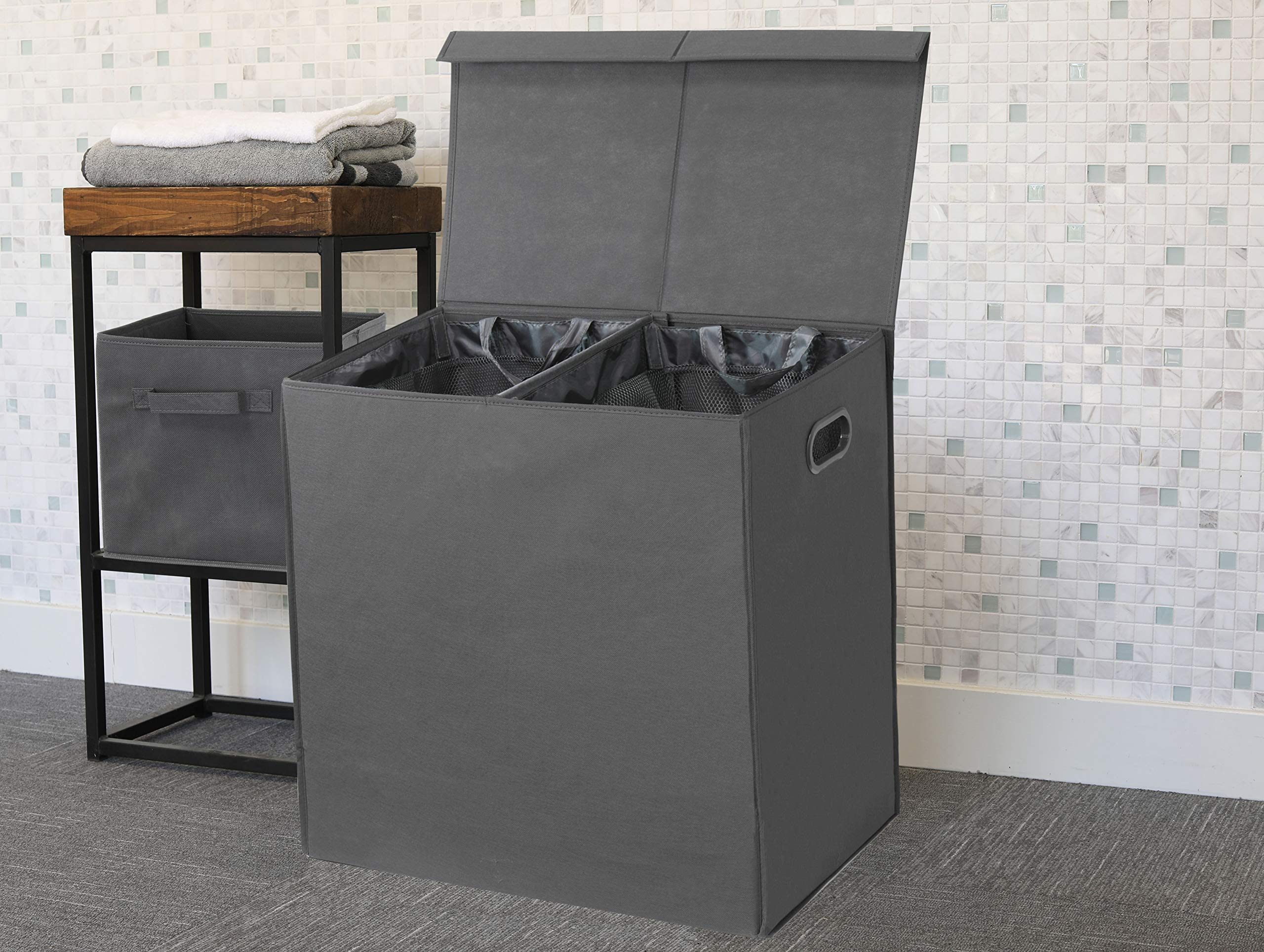 Collapsed Simple Houseware hamper for compact storage in small spaces.
