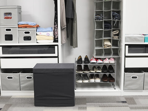 Simple Houseware portable hamper being moved between rooms.