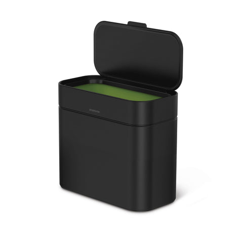 Detachable compost caddy used on the kitchen counter during prep for easy scrap collection.