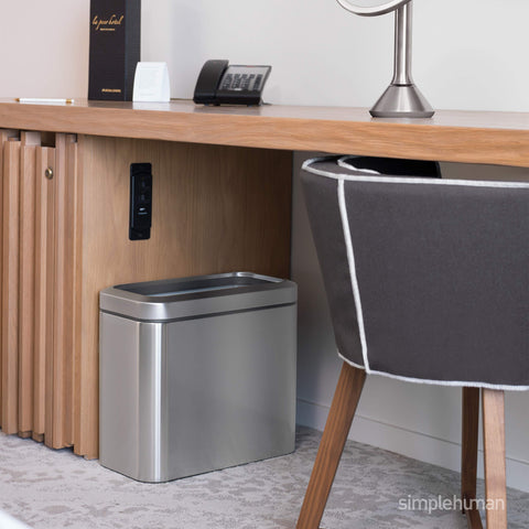 Simplehuman trash can with lift-off lid enabling easy liner changes in offices.