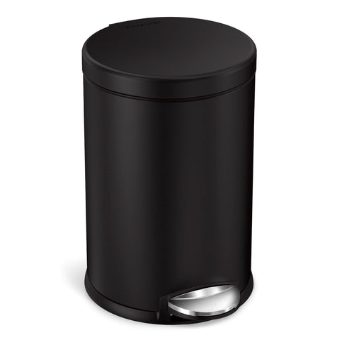simplehuman round bathroom trash can with lid closed silently for a calm space