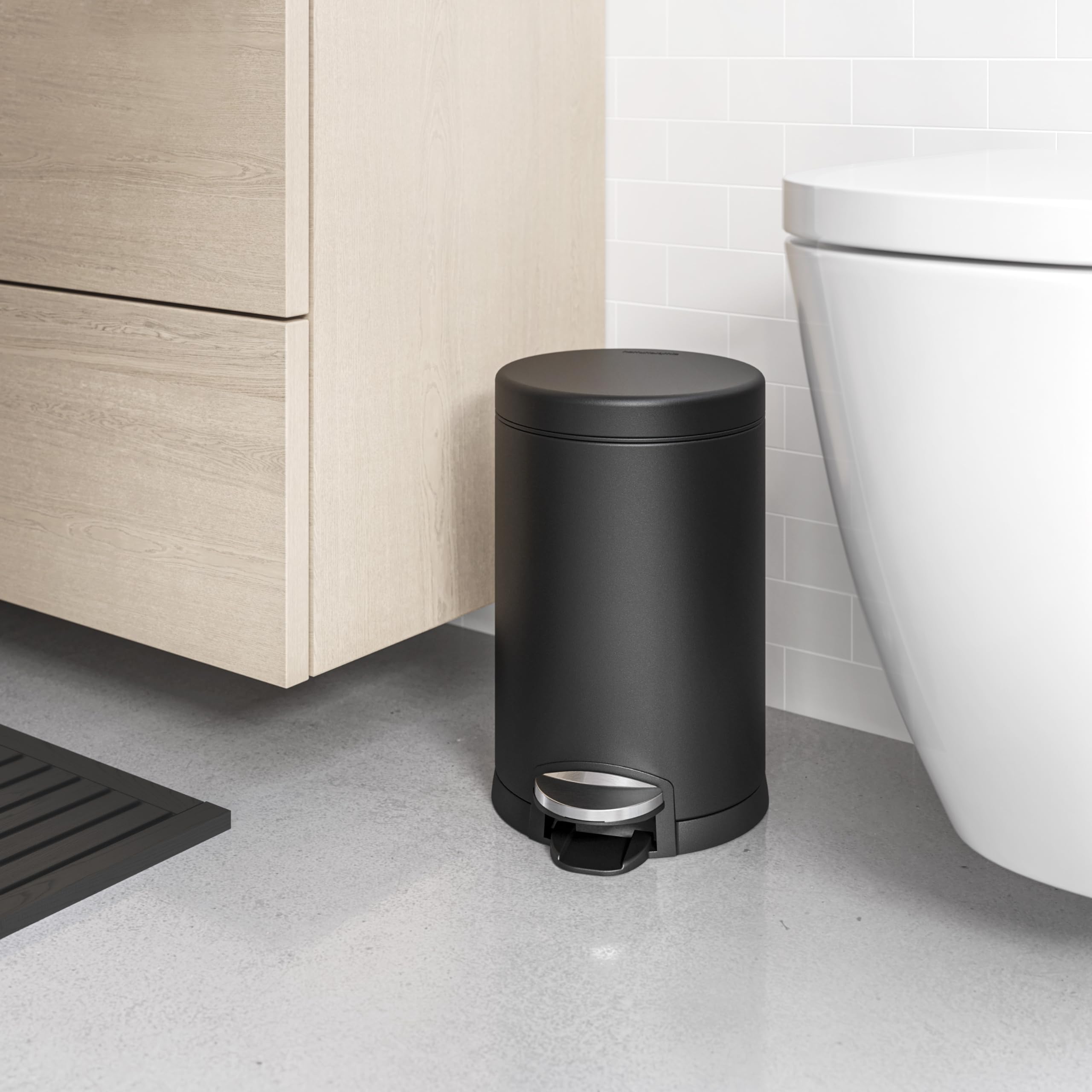 simplehuman round trash can with steel pedal for durable, quiet operation