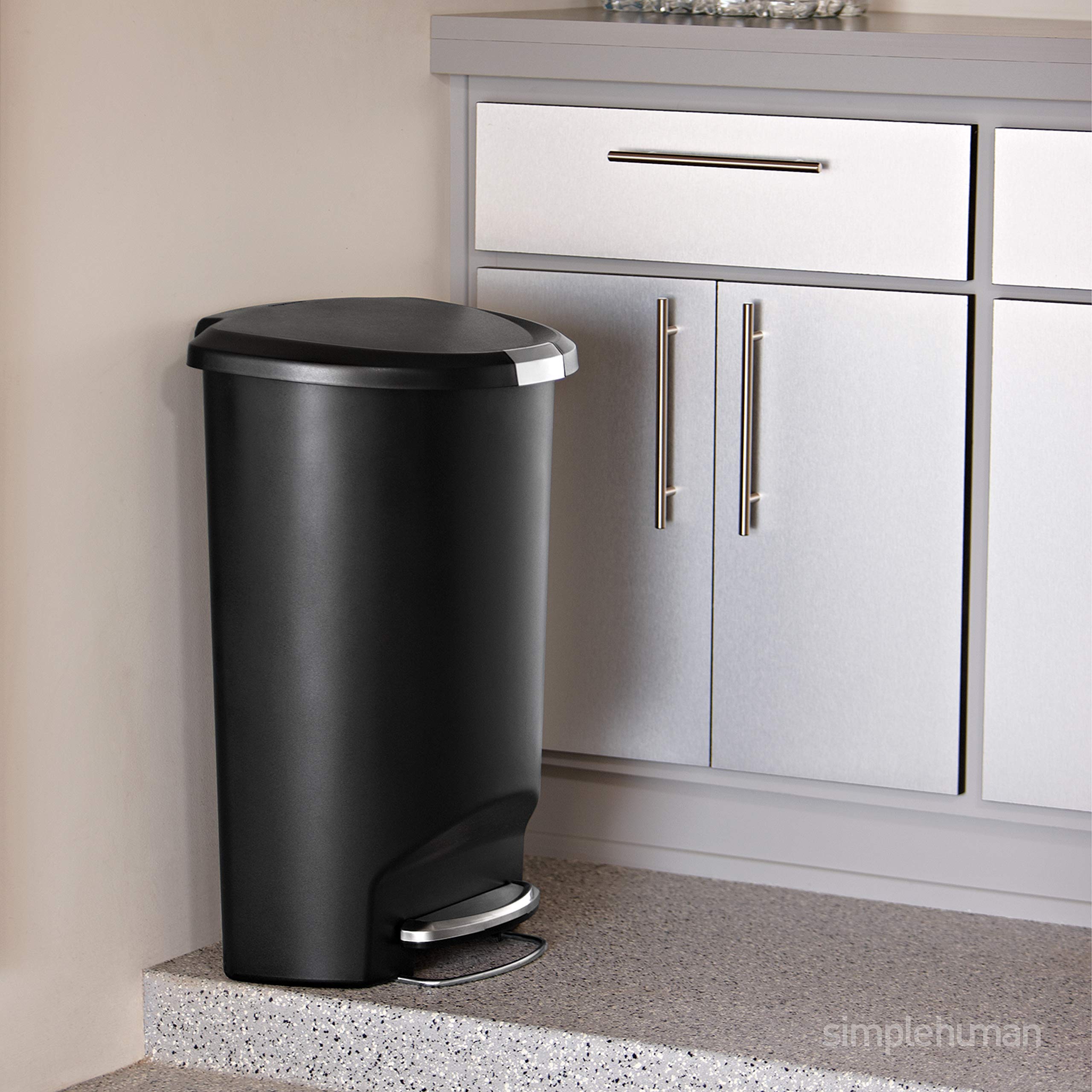 simplehuman trash can slide lock keeps contents secure from pets and kids